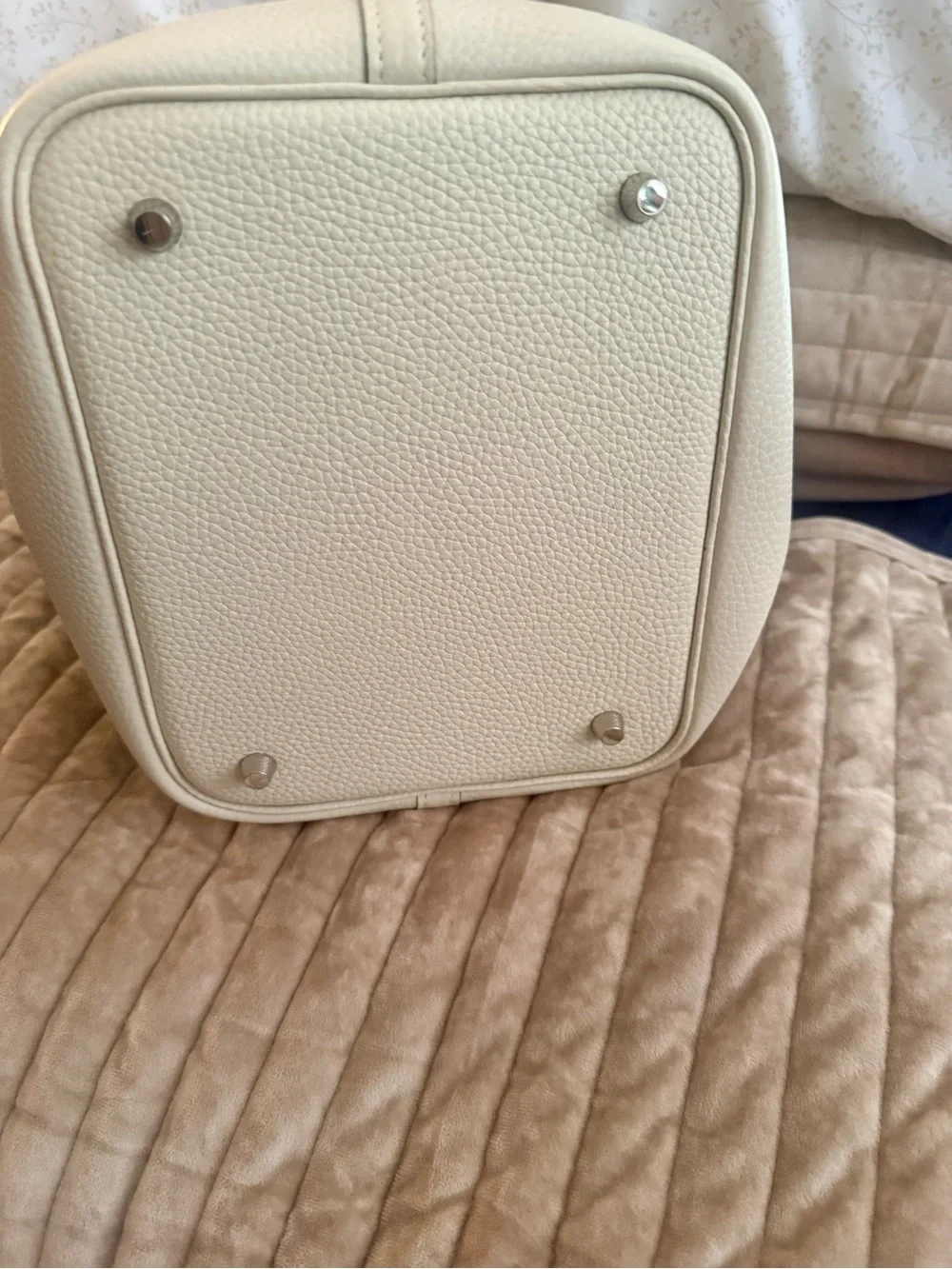 Leather bucket bag with charm